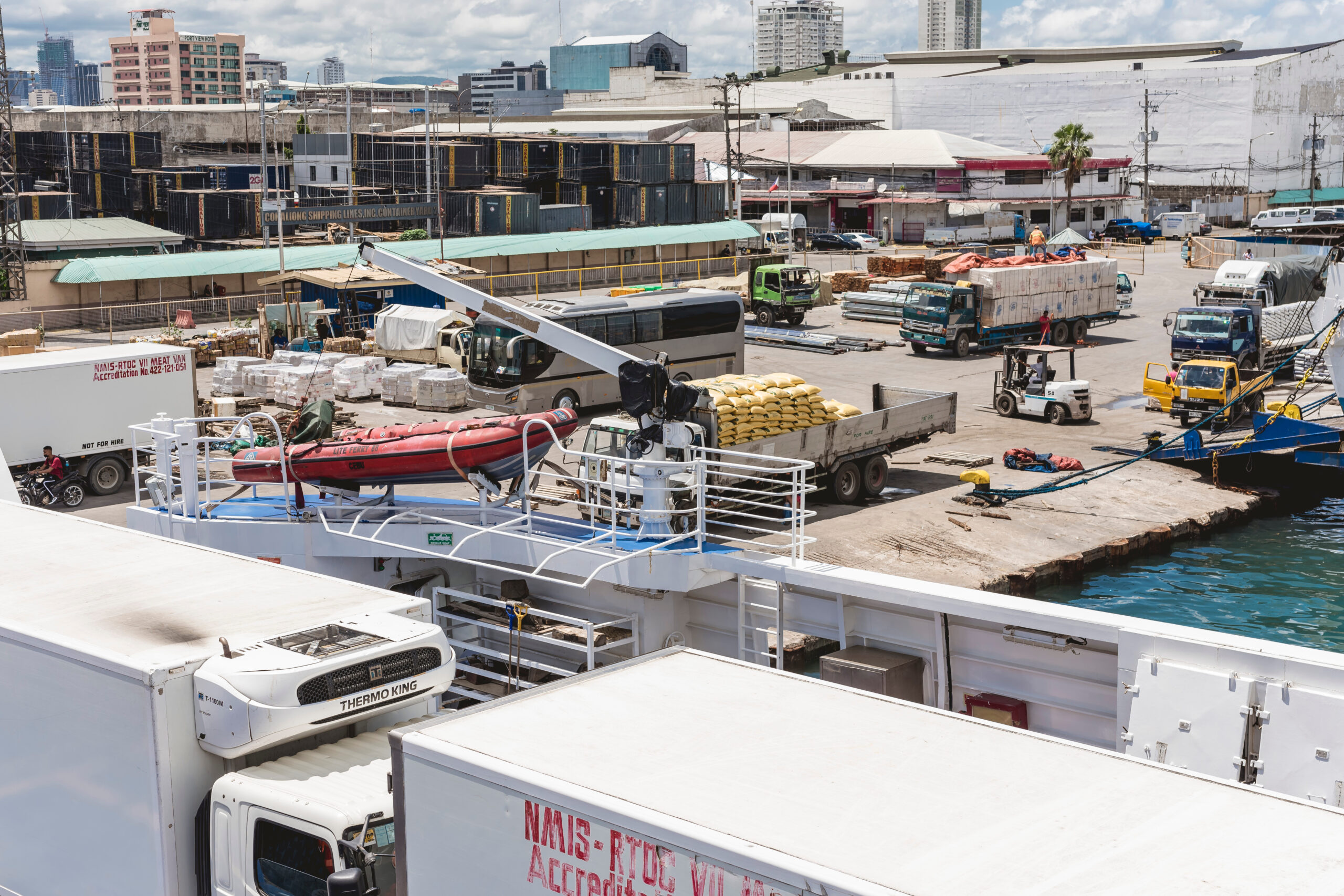 Cebu City, Philippines - May 2022: A RORO ship loaded with cargo freight trucks docked at the Port of Cebu.